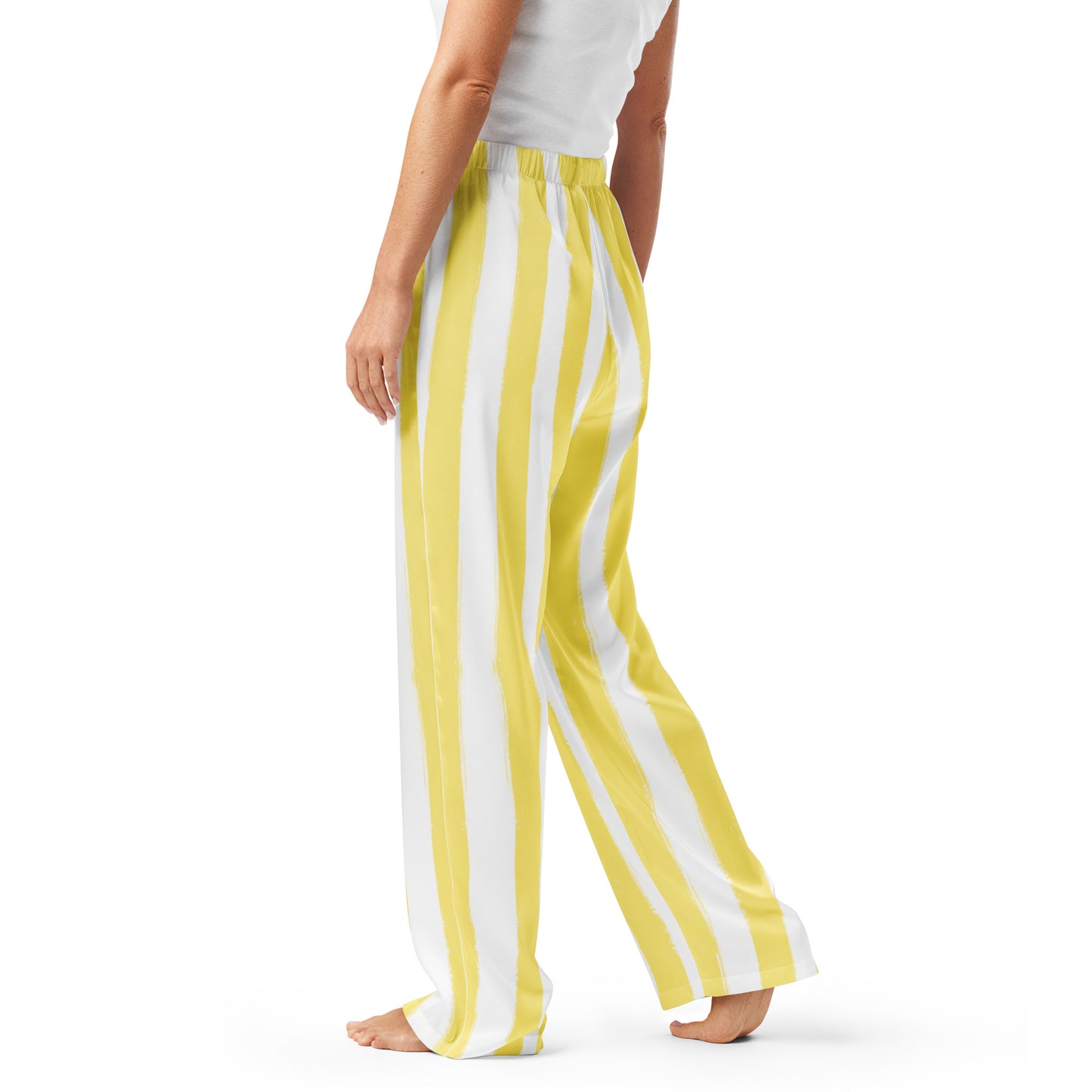Side profile of butter yellow striped pajama pants with piping detail and relaxed cut, ideal for lounging in style.