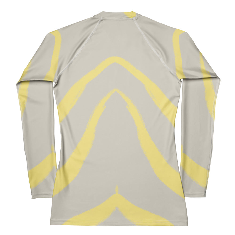 Flat lay of Panther & Palm women’s butter yellow rash guard with UPF 50+ protection and soft spandex-poly blend, perfect for active days.