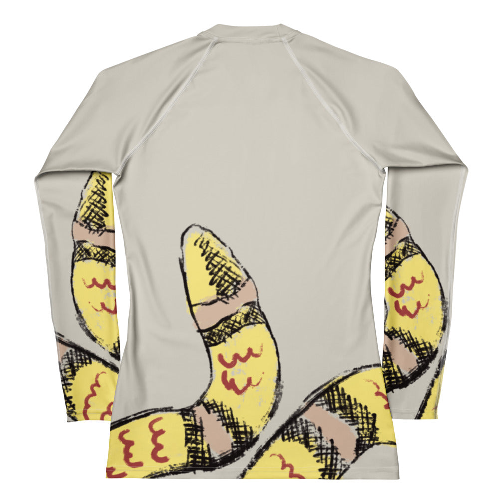 Flat lay of snake print women’s rash guard with gym gear, designed for workouts, yoga, and surf with sun protection (back).