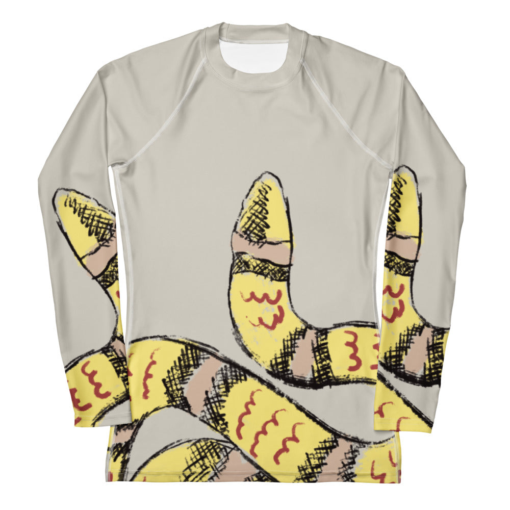 Flat lay of snake print women’s rash guard with gym gear, designed for workouts, yoga, and surf with sun protection (front).