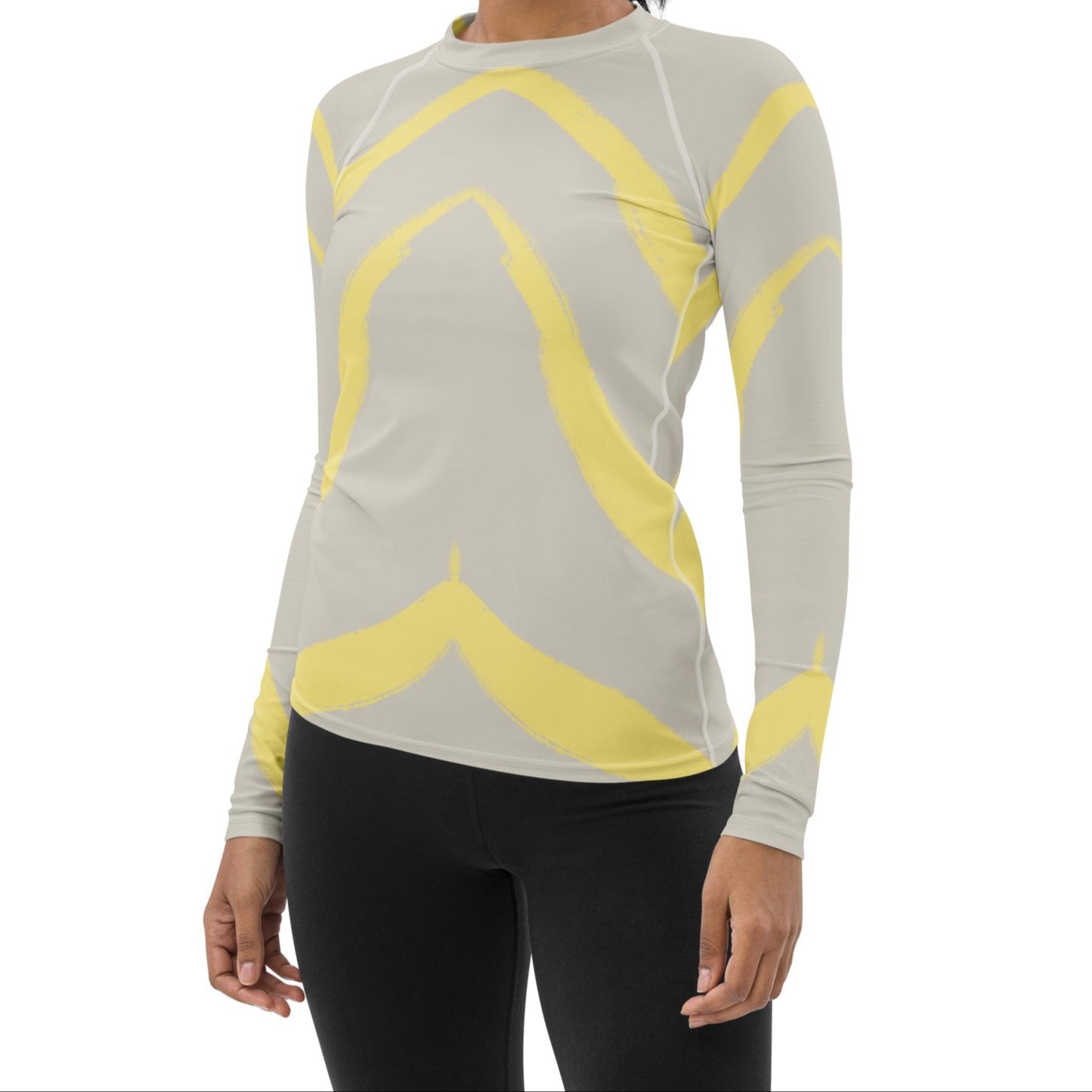 Front view of model in Panther & Palm butter yellow activewear top, highlighting fitted silhouette, extended length, and breathable stretch fabric.