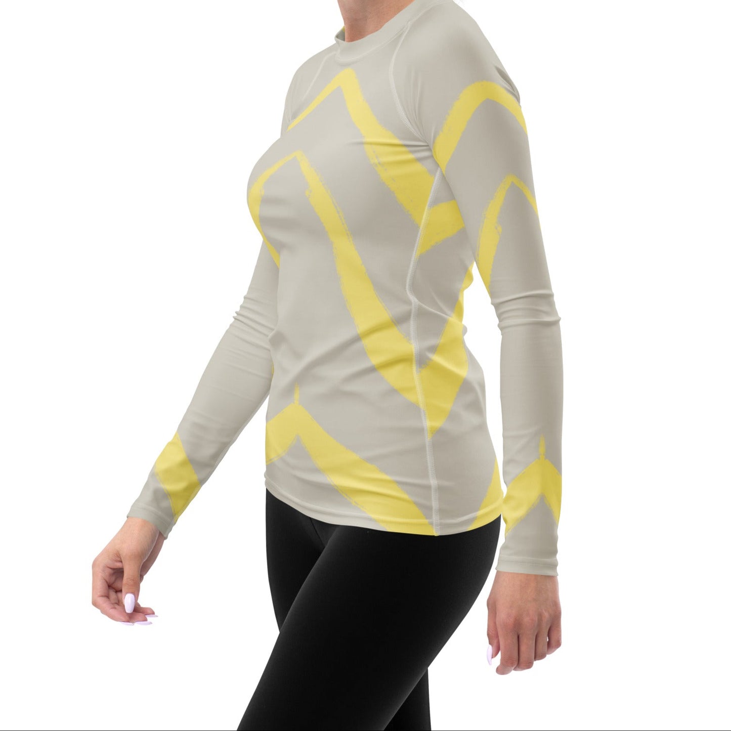 Angled view of model in Panther & Palm butter yellow activewear top, highlighting fitted silhouette, extended length, and breathable stretch fabric.