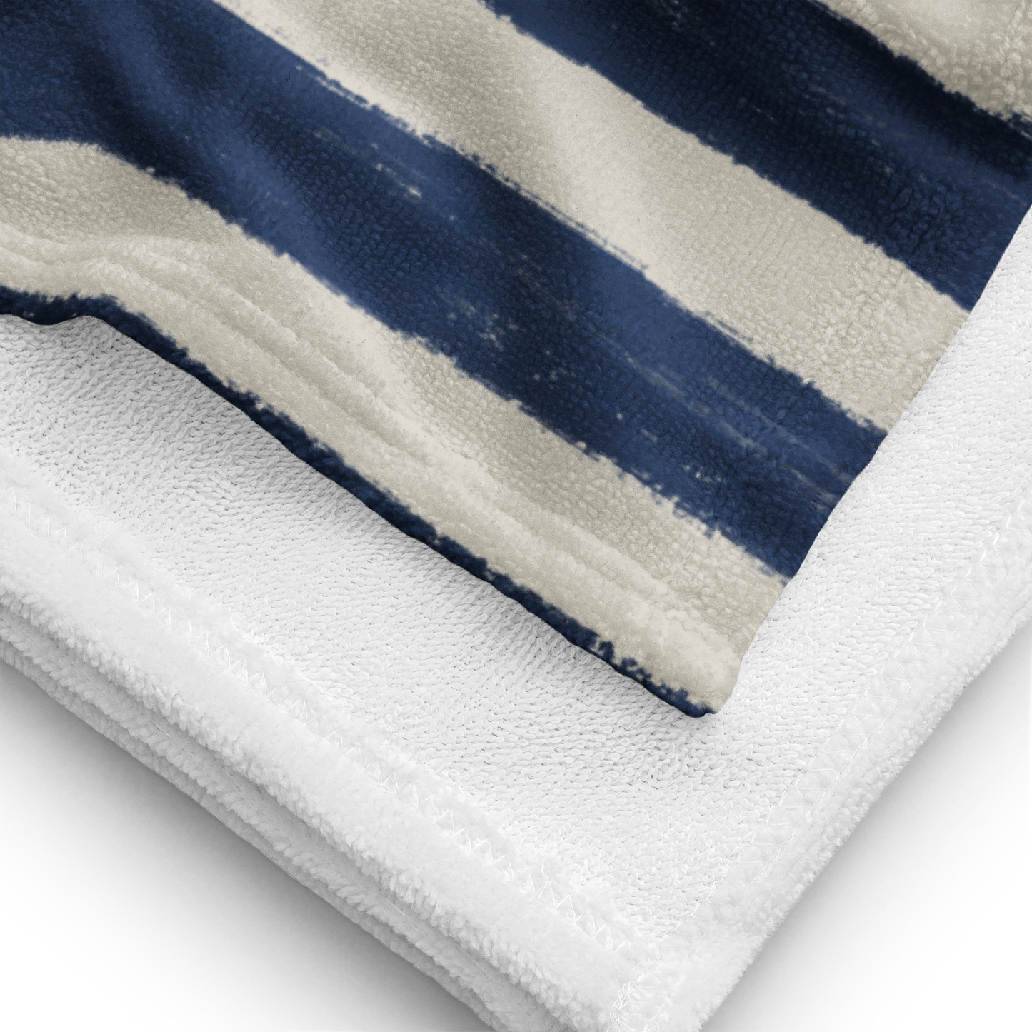 Close-up detail of cotton-poly blend towel fabric with navy stripe print – soft absorbent snake beach towel with premium texture