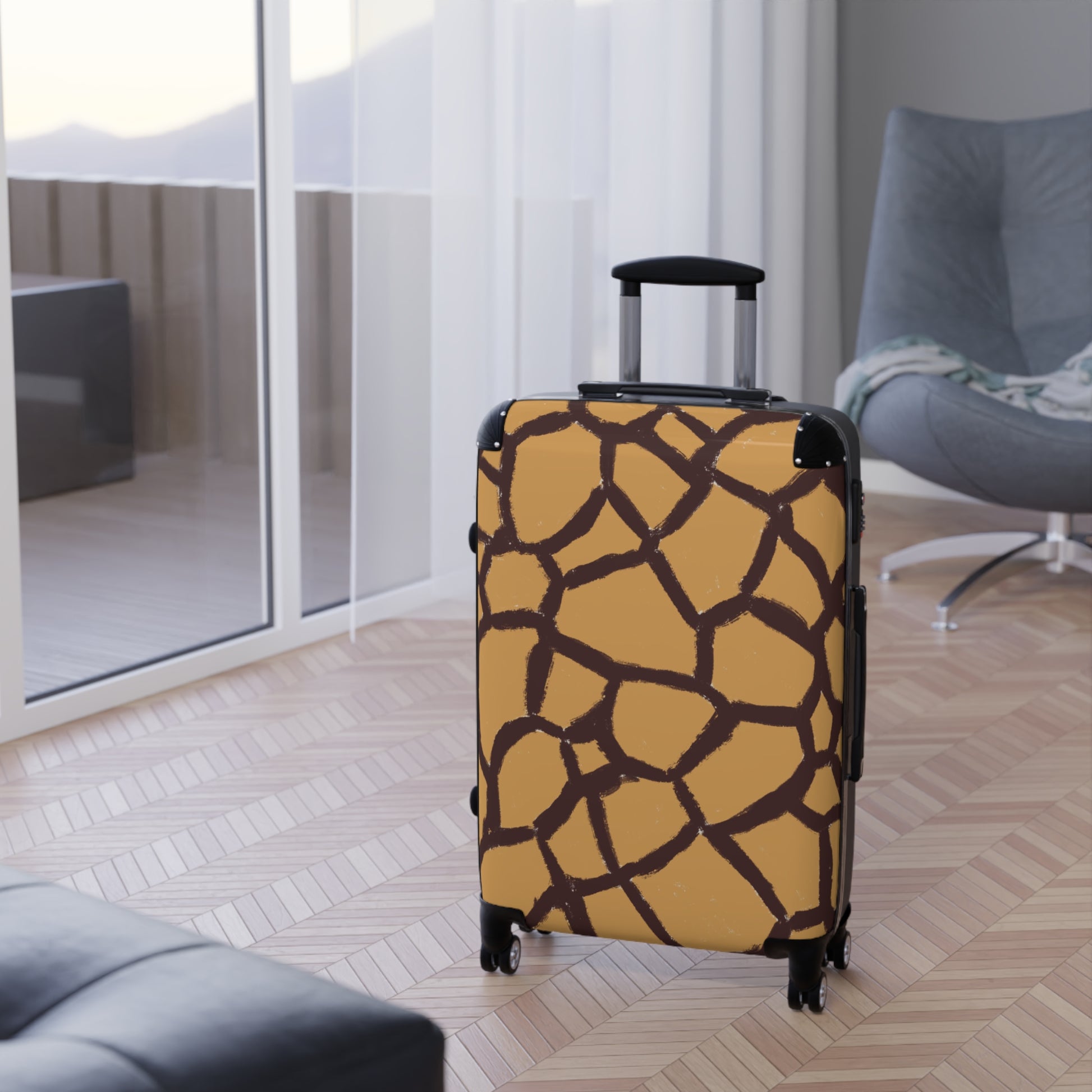 Giraffe pattern luggage by Panther & Palm placed in a stylish hotel room.