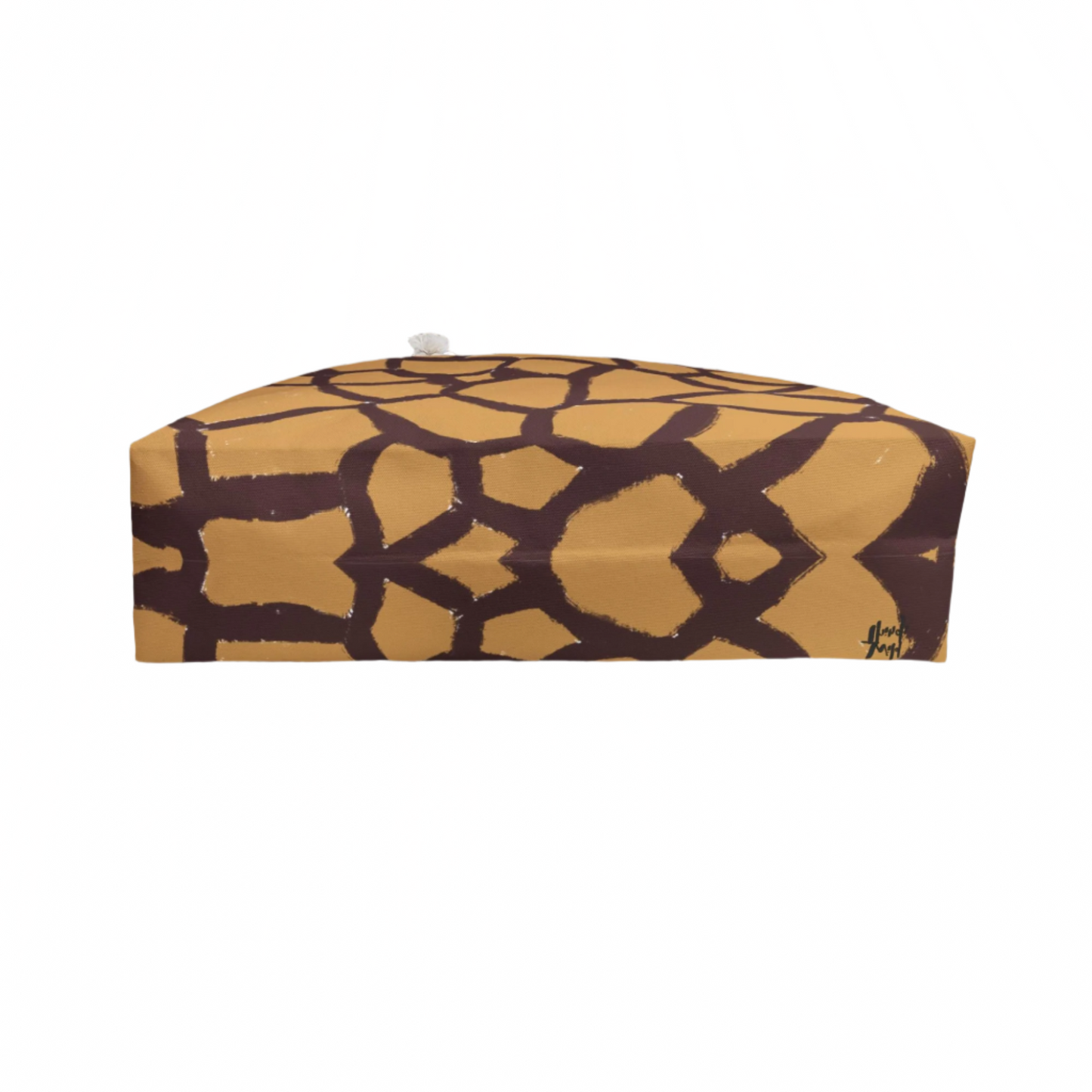 Oversized animal print travel tote with gold-tone grommets and durable T-bottom, perfect for stylish weekend escapes.