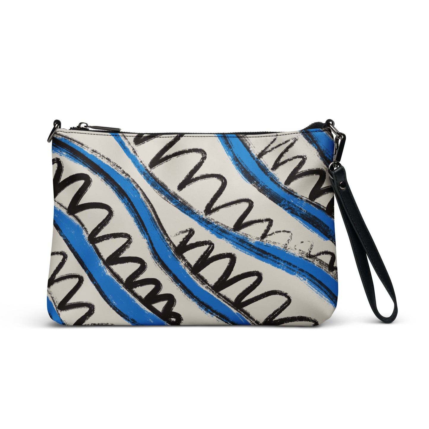 Blue and white tropical stripe crossbody bag in vegan leather with black wrist strap and zip closure.