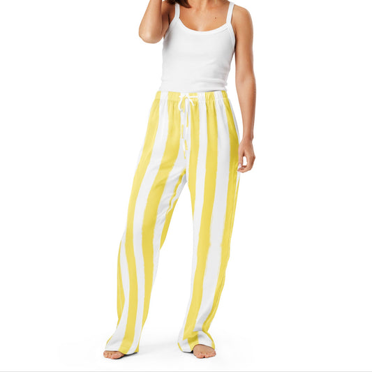 Model standing in butter yellow striped pajama pants with drawstring waist, highlighting breathable fabric and relaxed lounge style.