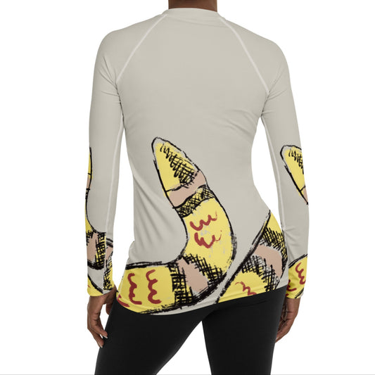 Woman wearing yellow snake print long-sleeve rash guard by Panther & Palm, showcasing UPF 50+ activewear with ergonomic fit.