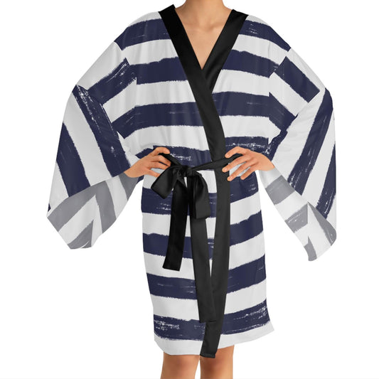 Model wearing Panther & Palm brushstroke stripe robe with black trim, featuring relaxed fit and navy-on-white design. Made in the USA. 
