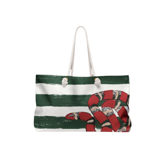 Front view of the Snake Stripe Weekender Bag featuring green Breton-style stripes and a hand-drawn red snake illustration, displayed against a neutral background with soft shadows.